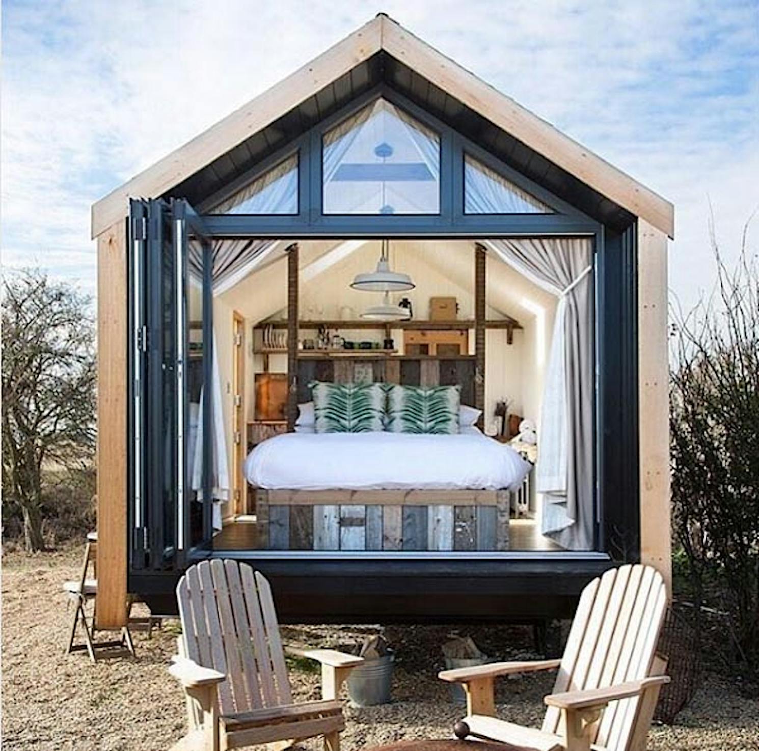 Tiny home in England using large sliding glass doors