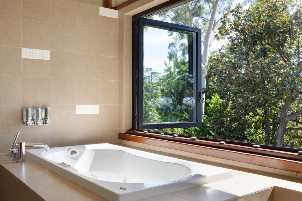 bathtub by window