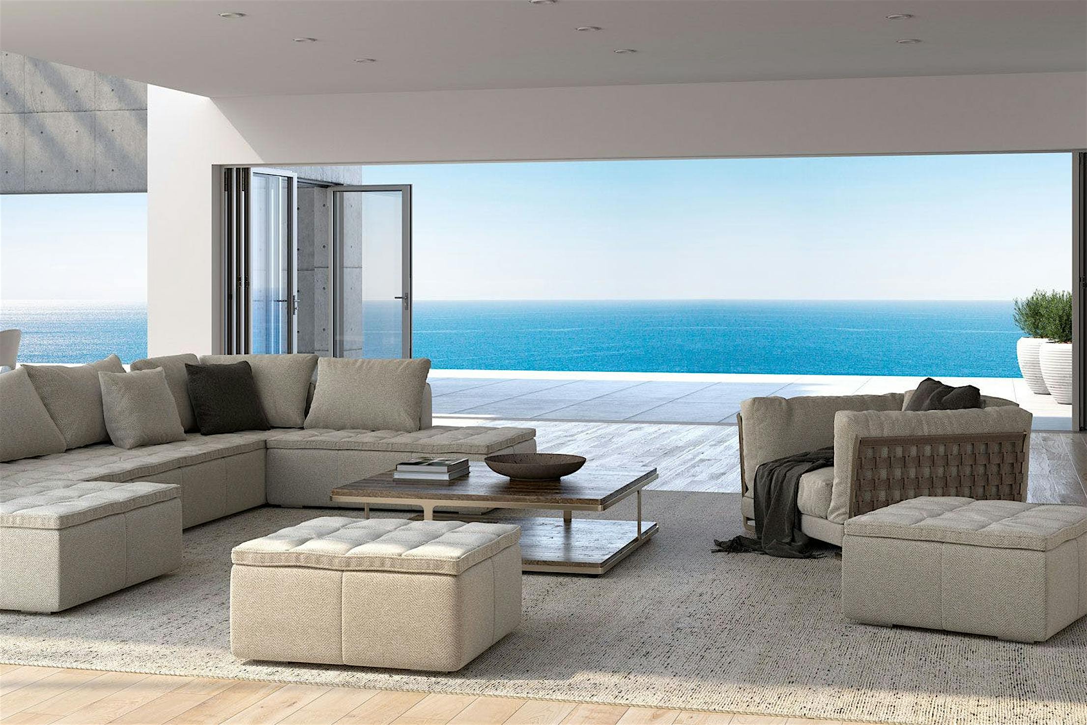 A living room with folding glass walls for a stunning view of the ocean