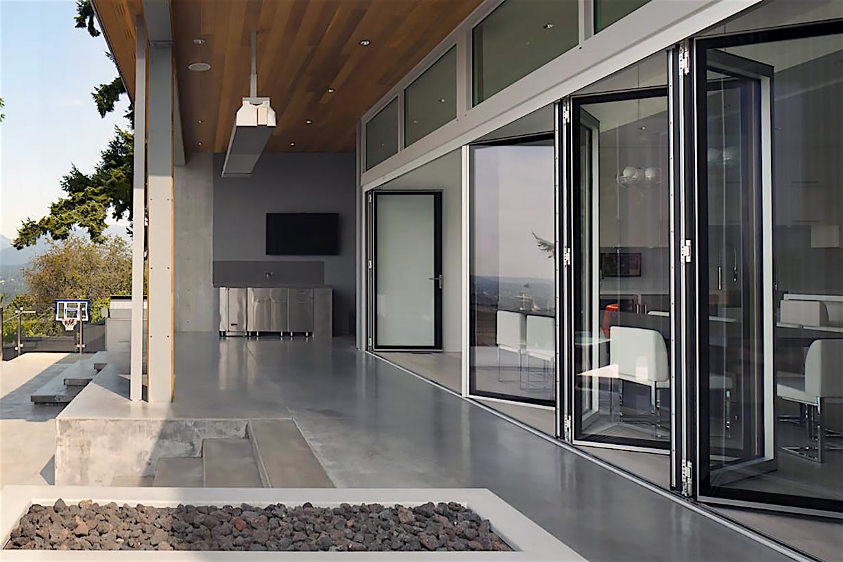 Pool house folding glass walls