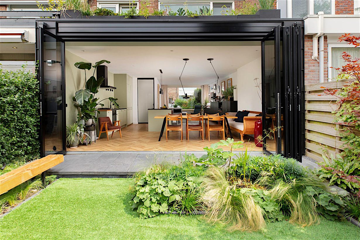 Townhouse backyard featuring folding patio doors - open view