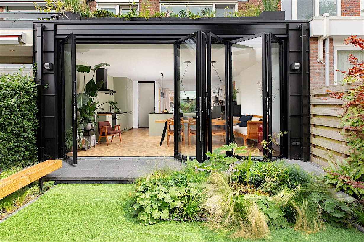 Townhouse backyard featuring folding patio doors - partially open view