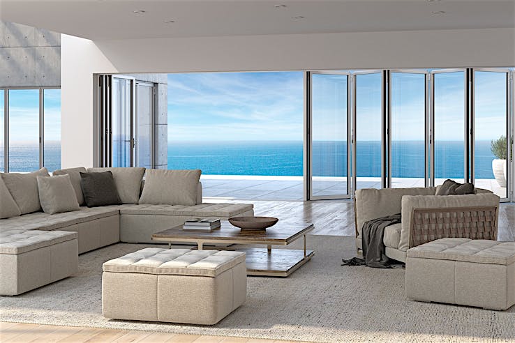 Modern Living Room with Folding Glass Walls and a View of the Ocean