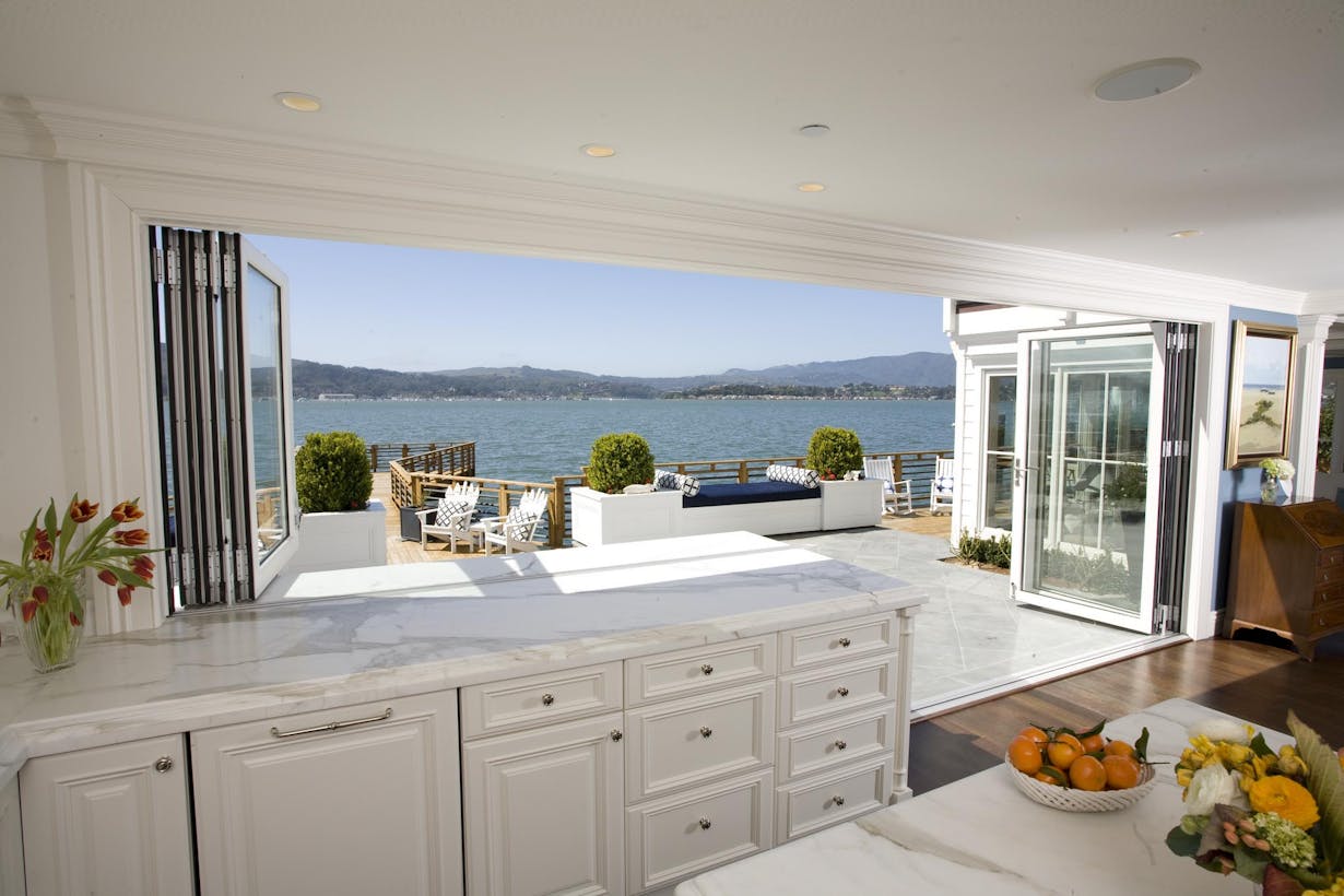 Kitchen Window Doors Combination Design with View of the Mountains around the Bay