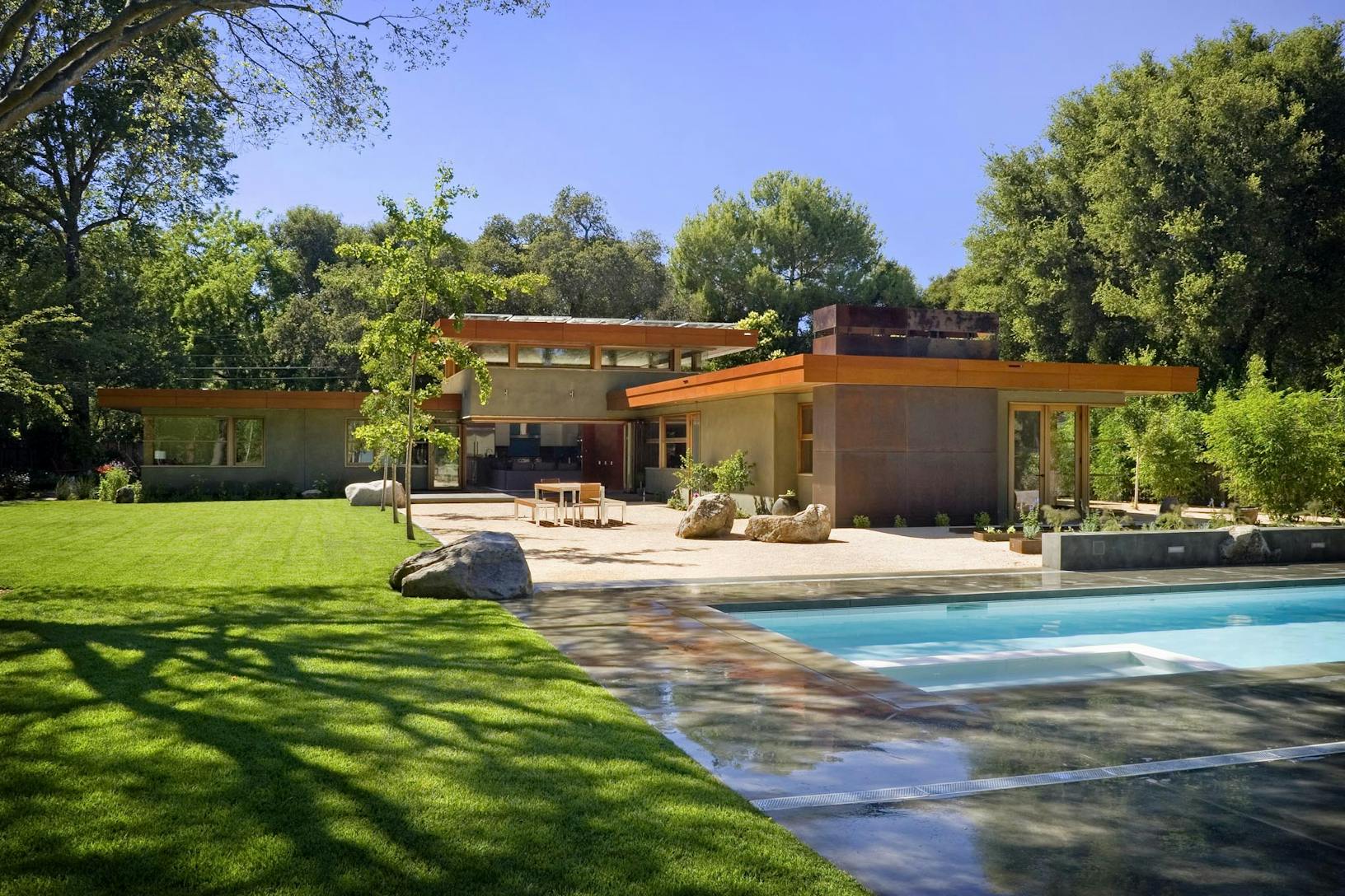WD65 Residence with a pool and trees _ wood framed glass walls