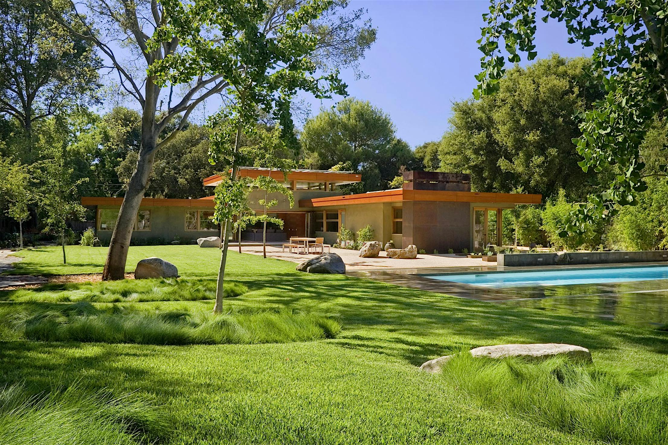 WD65 Residence with a pool and trees _ wood framed glass walls