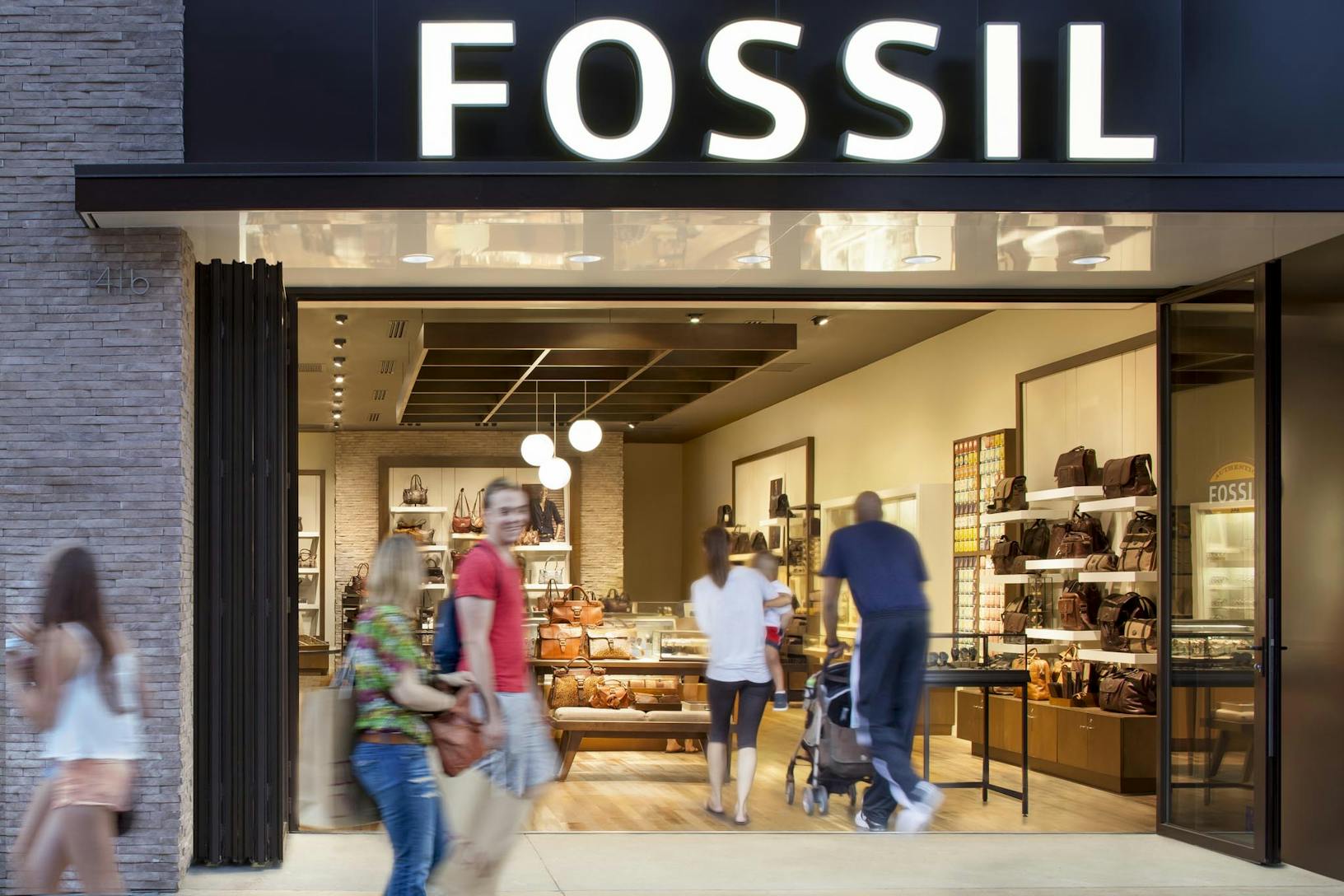 SL70 Retail Folding Entry Doors at the Fossil Store in Santa Monica, CA - Opened Exterior Night View