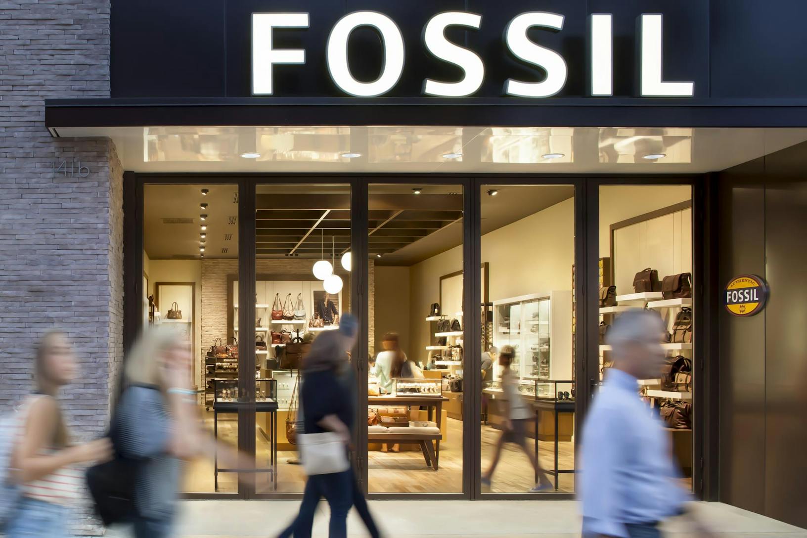 SL70 Retail Folding Entry Doors at the Fossil Store in Santa Monica, CA - Closed Exterior Night View