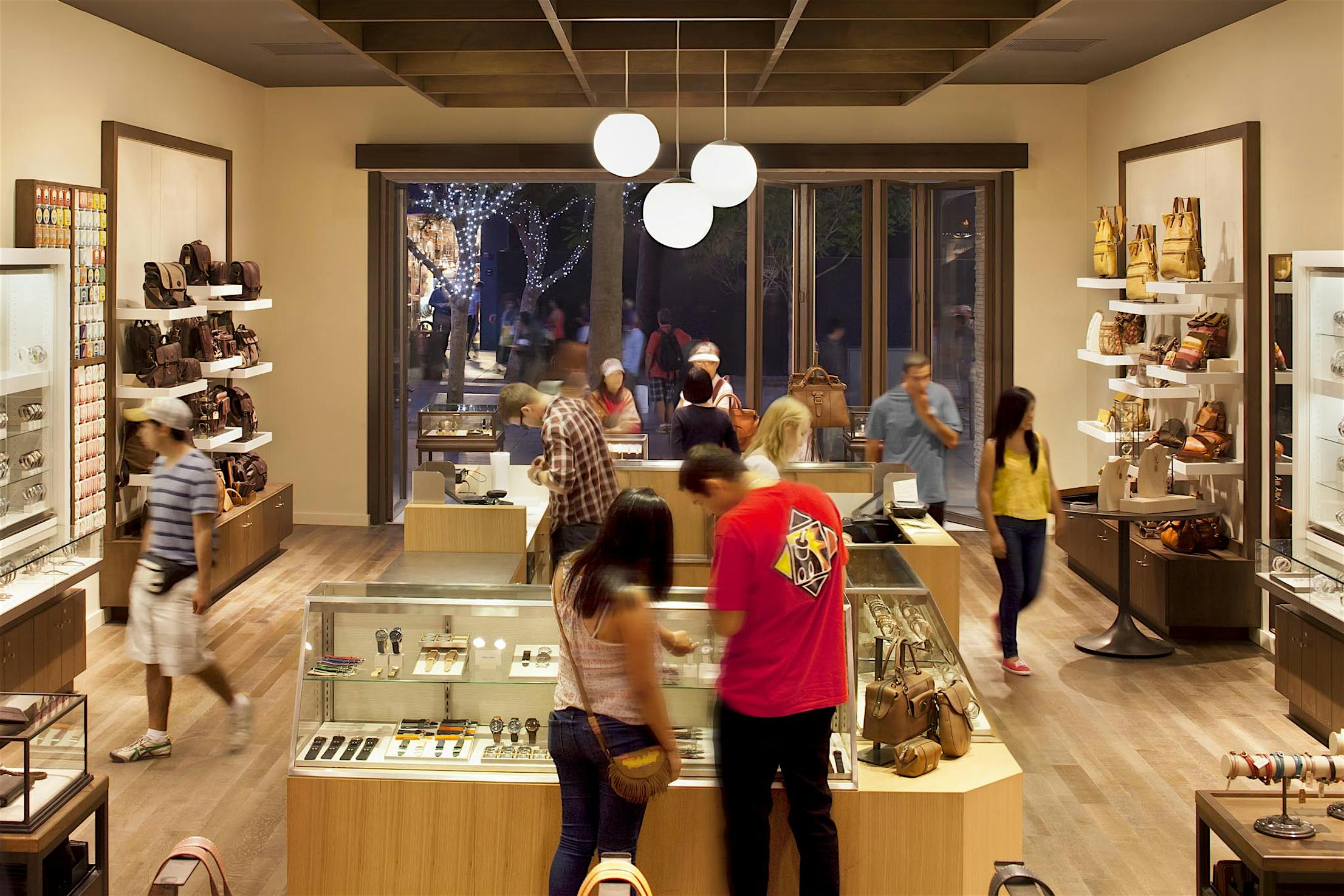 SL70 Retail Folding Entry Doors at the Fossil Store in Santa Monica, CA - Opening Interior Night View
