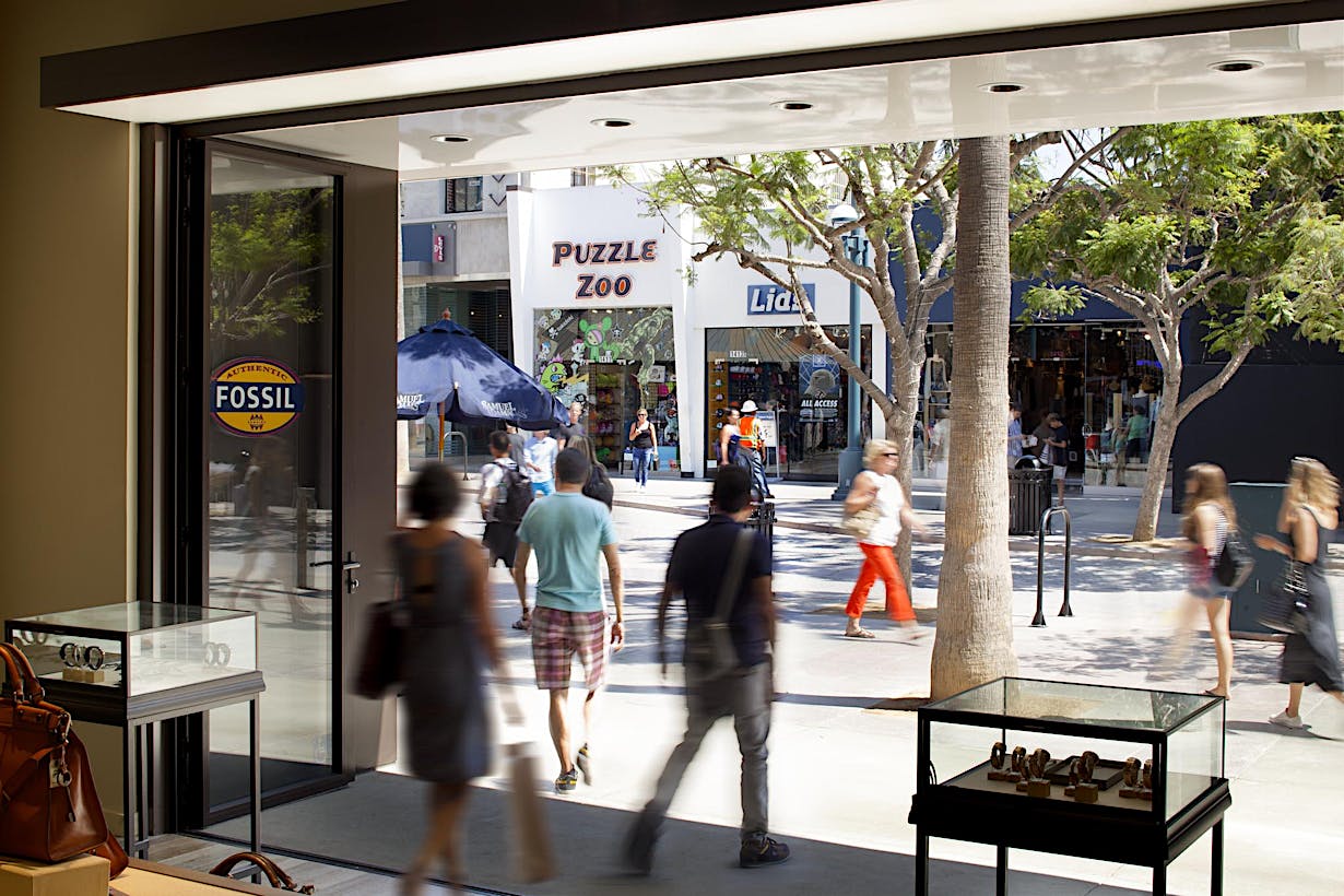 SL70 Retail  Folding Entry Doors at the Fossil Store in Santa Monica, CA - Opened Interior Day View