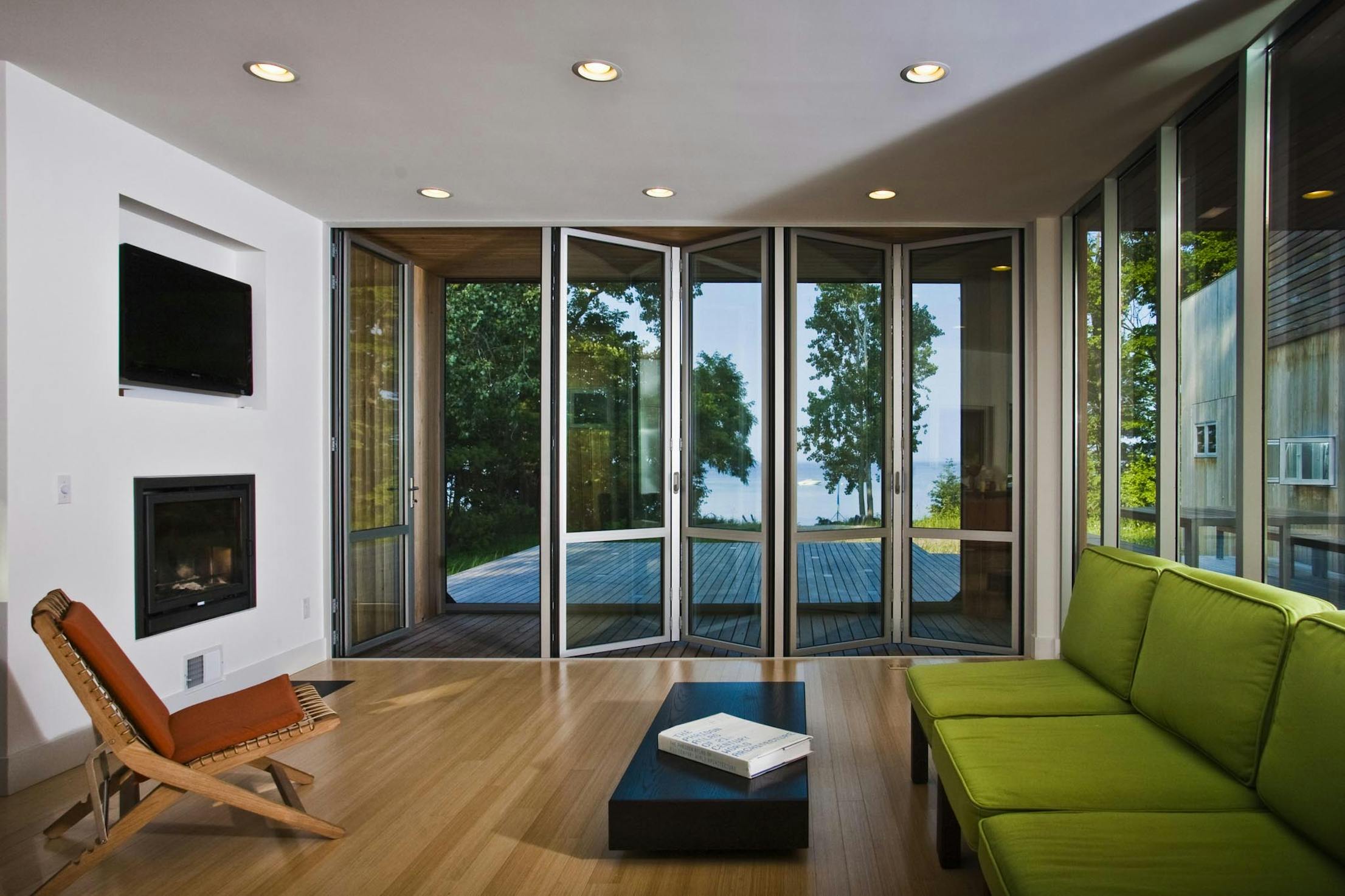 A living room with folding patio doors