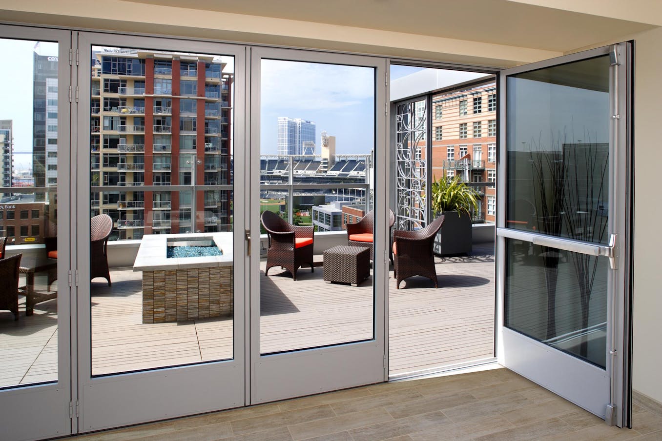 Folding glass doors with a view of a city
