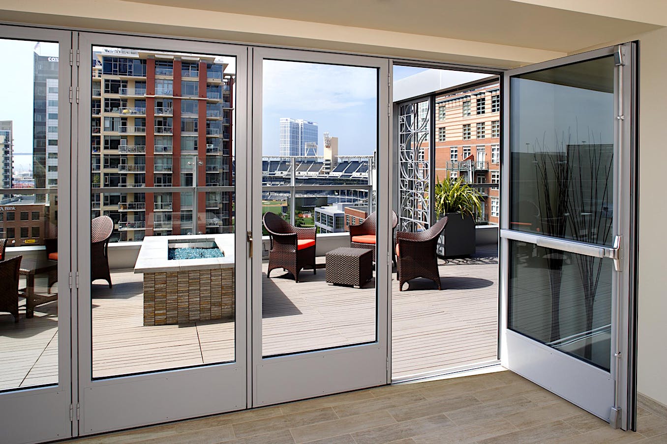 Folding glass doors with a view of a city