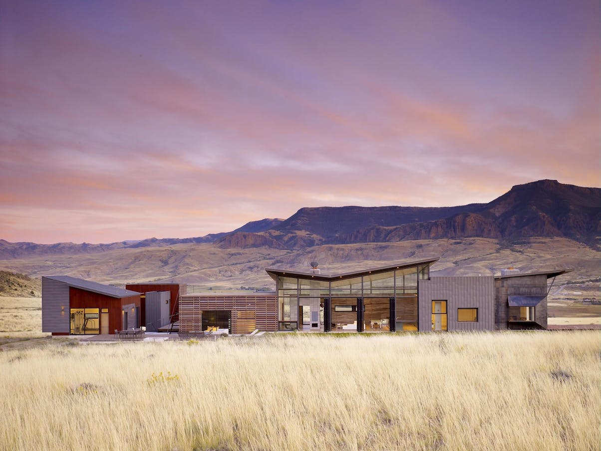 Residential exterior with folding walls in a desert landscape 
