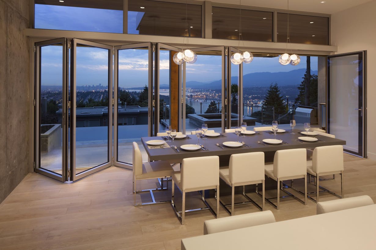 NW Aluminum 840 View of the city from a dining room with folding glass doors 