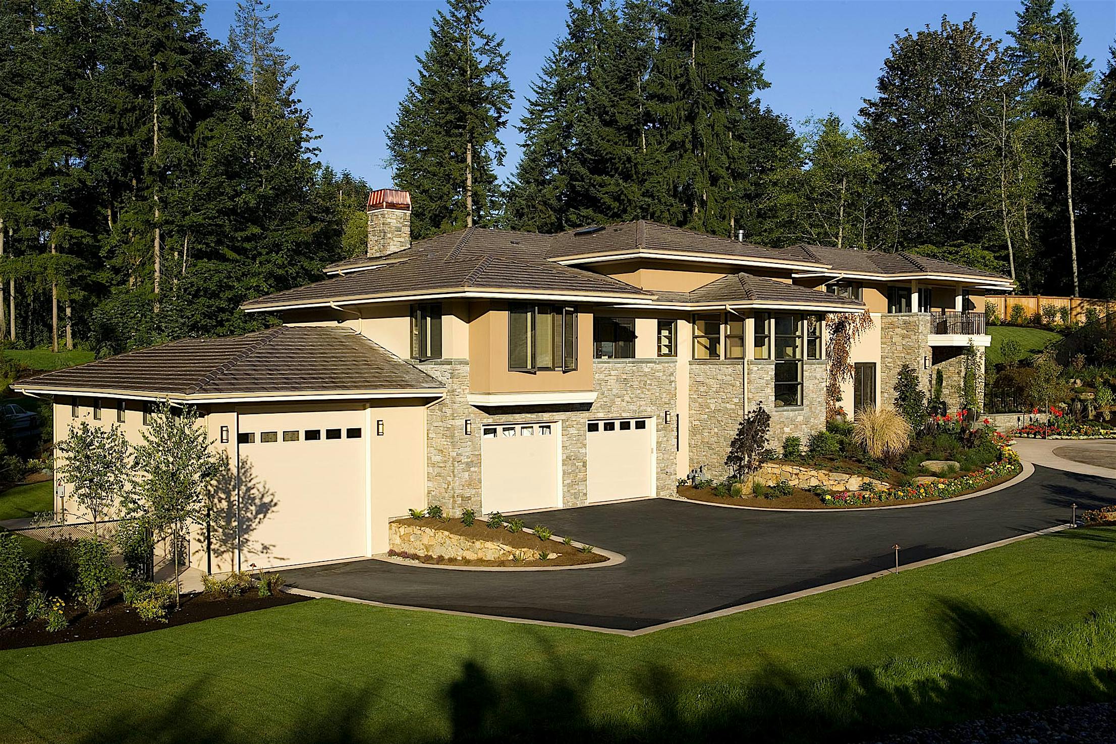 A house with large front yard and aluminum clad folding doors