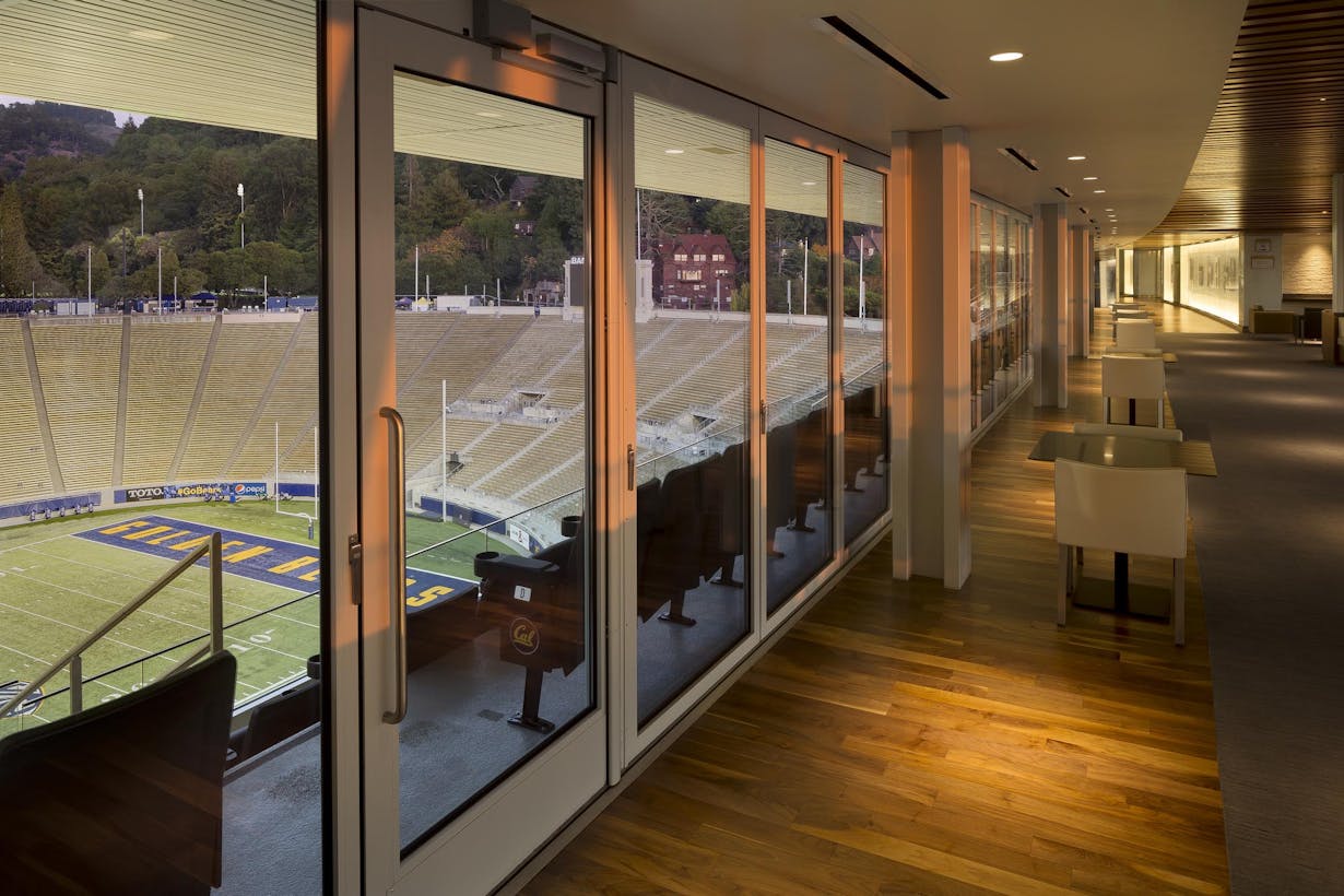 Sliding glass walls at the Cal Memorial Stadium with view to the seating area 