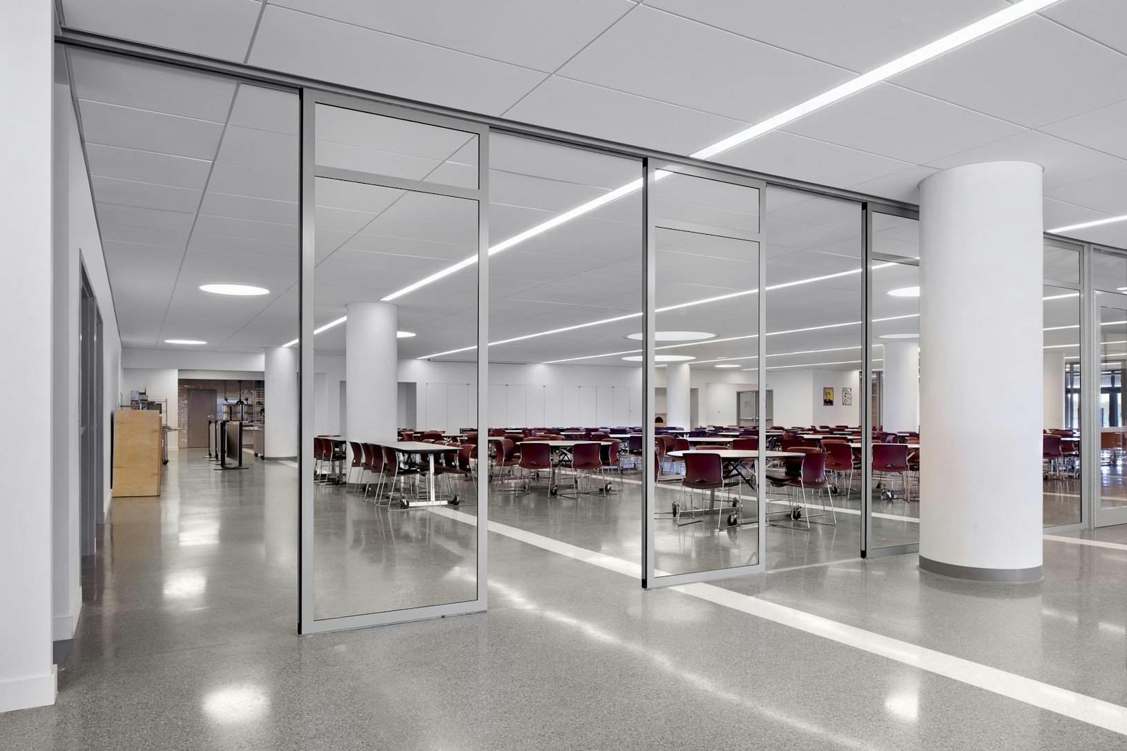 Commercial segmented curved sliding glass walls at The Union Nations International School in NY