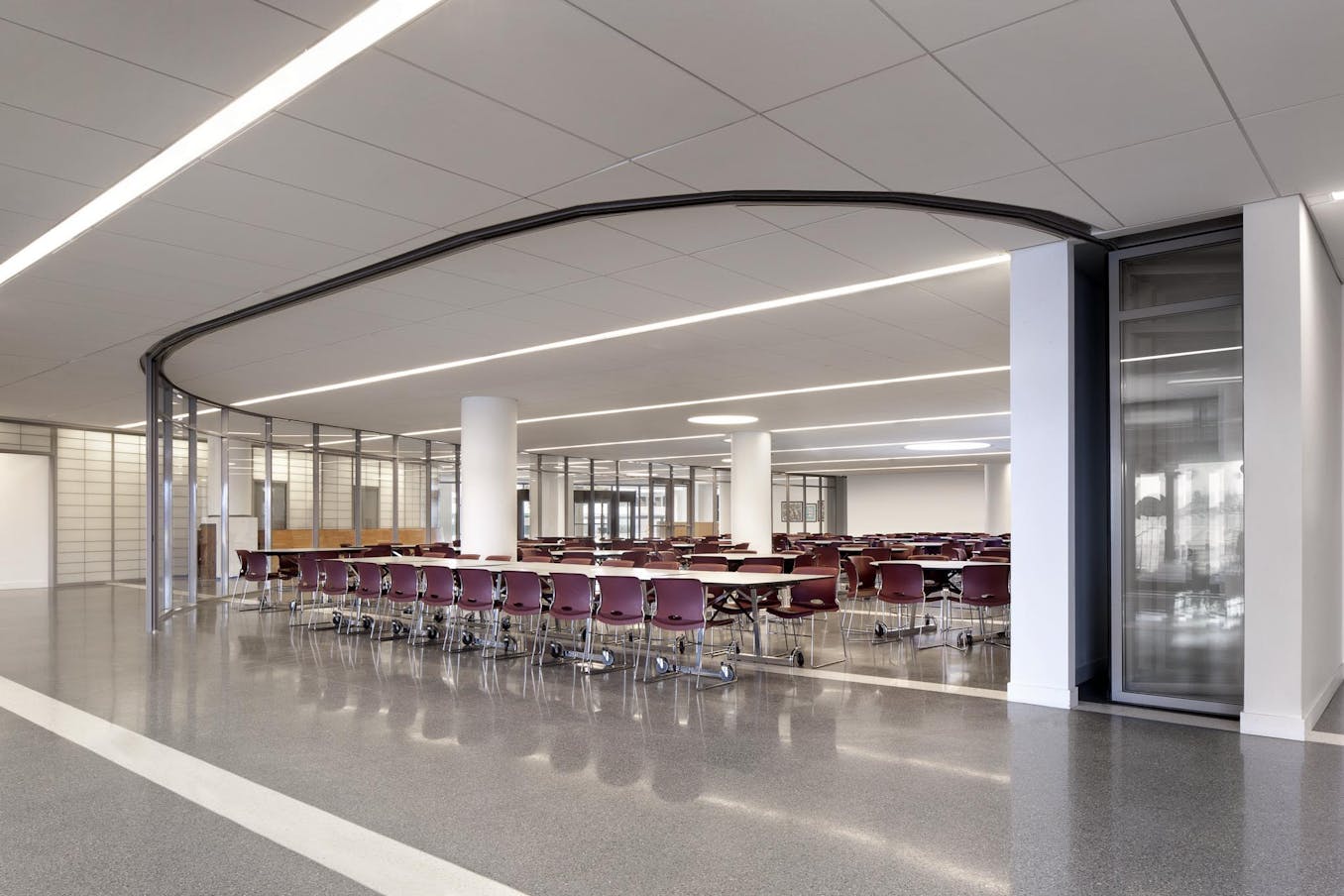 commercial collaborative learning space in school design  - segmented curved sliding walls opened exterior 
