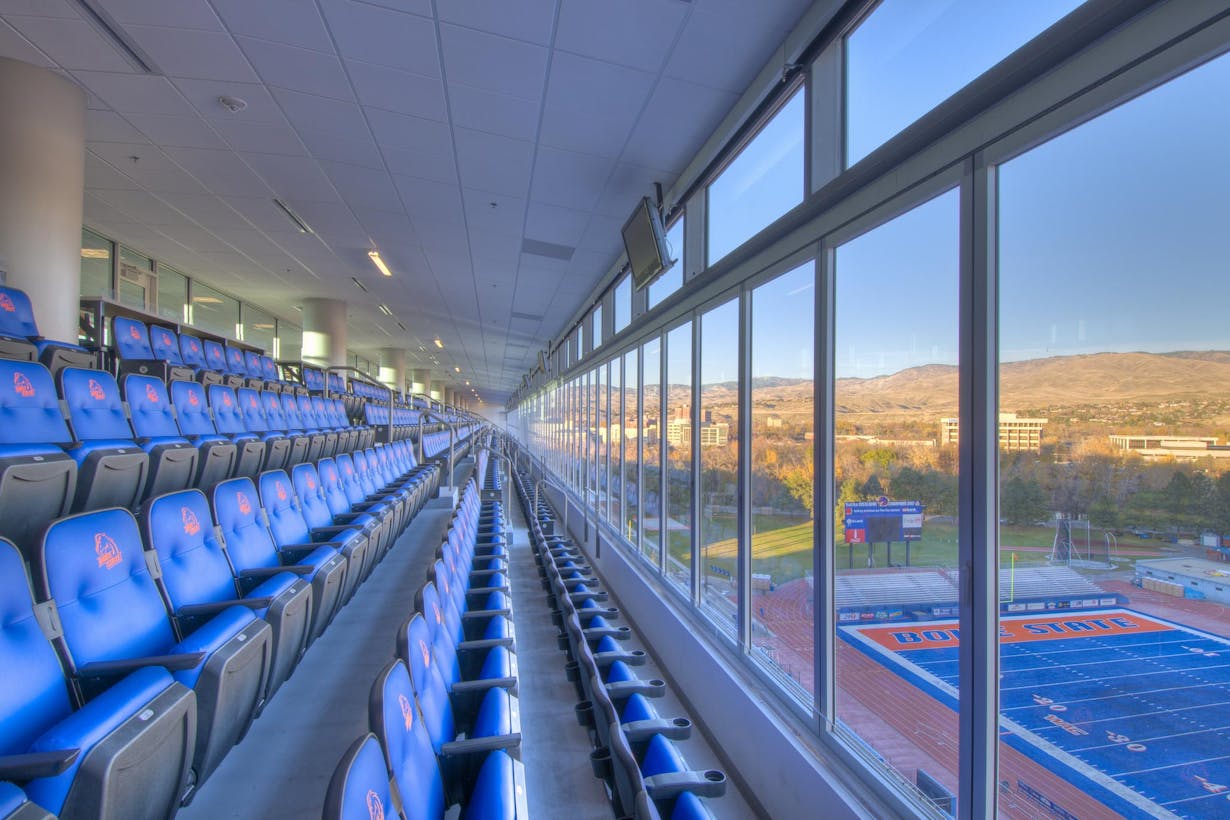 Boise State Stadium bleachers divided by large glass walls overlooking the field - HSW60 Sliding