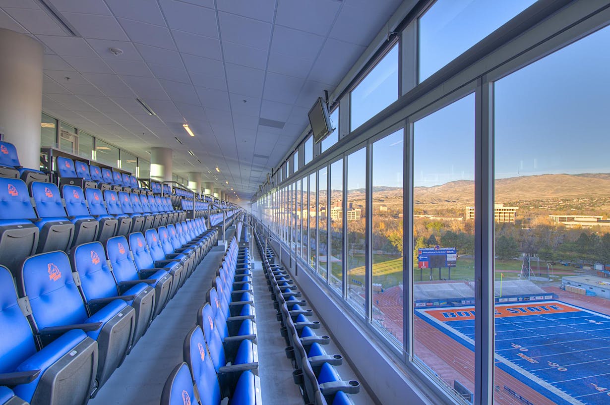 Boise State Stadium bleachers divided by large glass walls overlooking the field - HSW60 Sliding