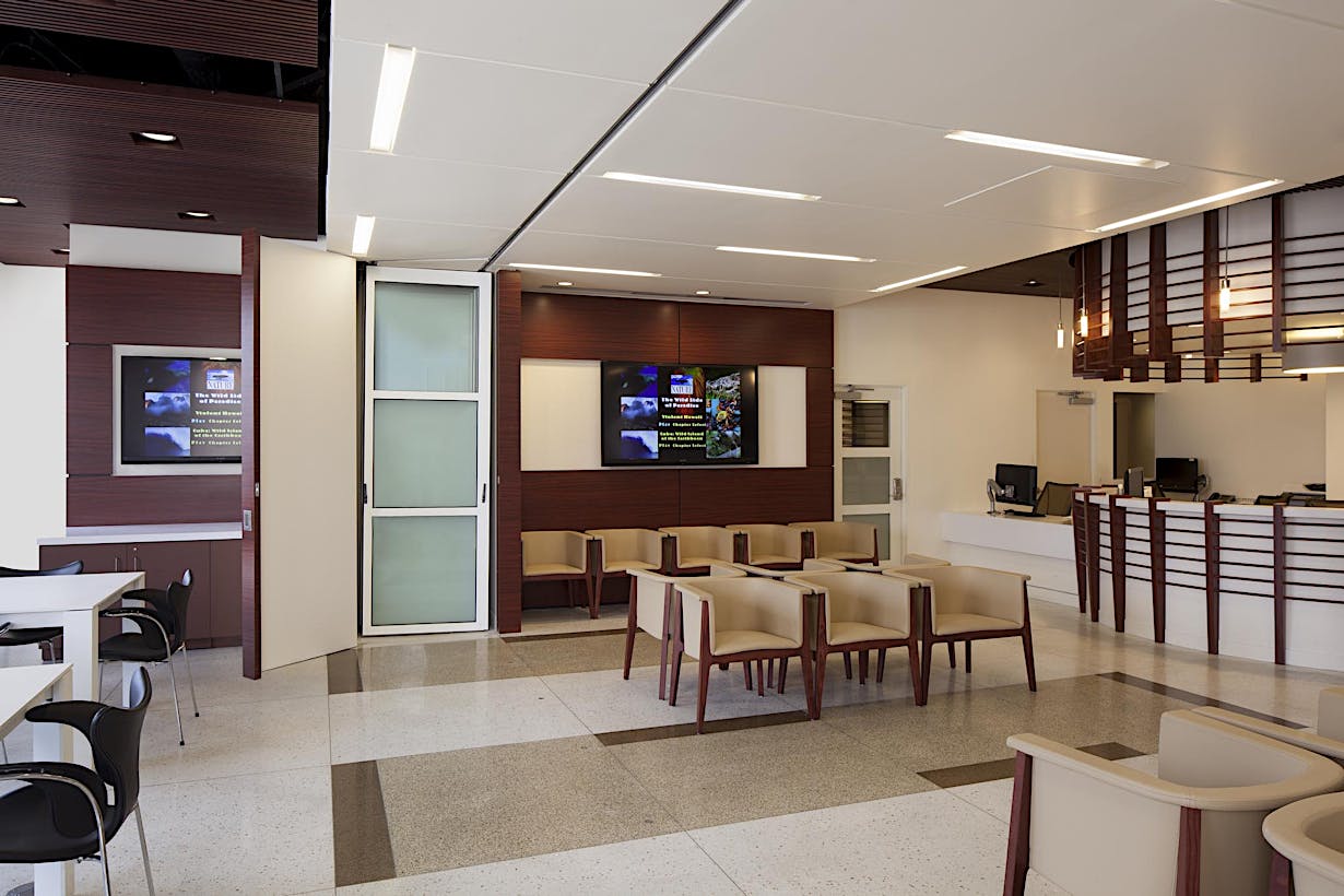 Healthcare waiting room with open folding glass walls