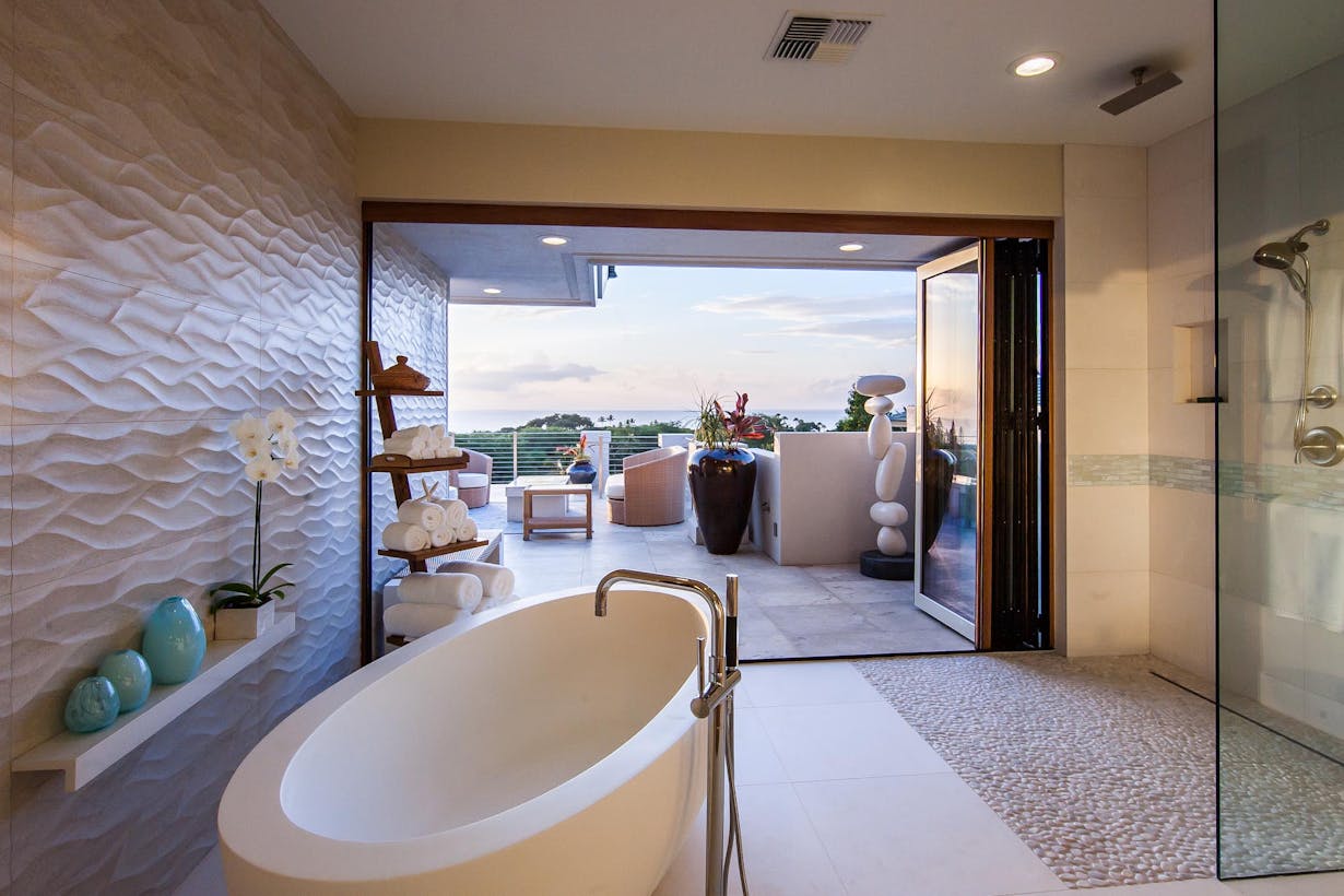 Modern Bathroom with Large Glass Doors and an Outside Ocean View  - Folding