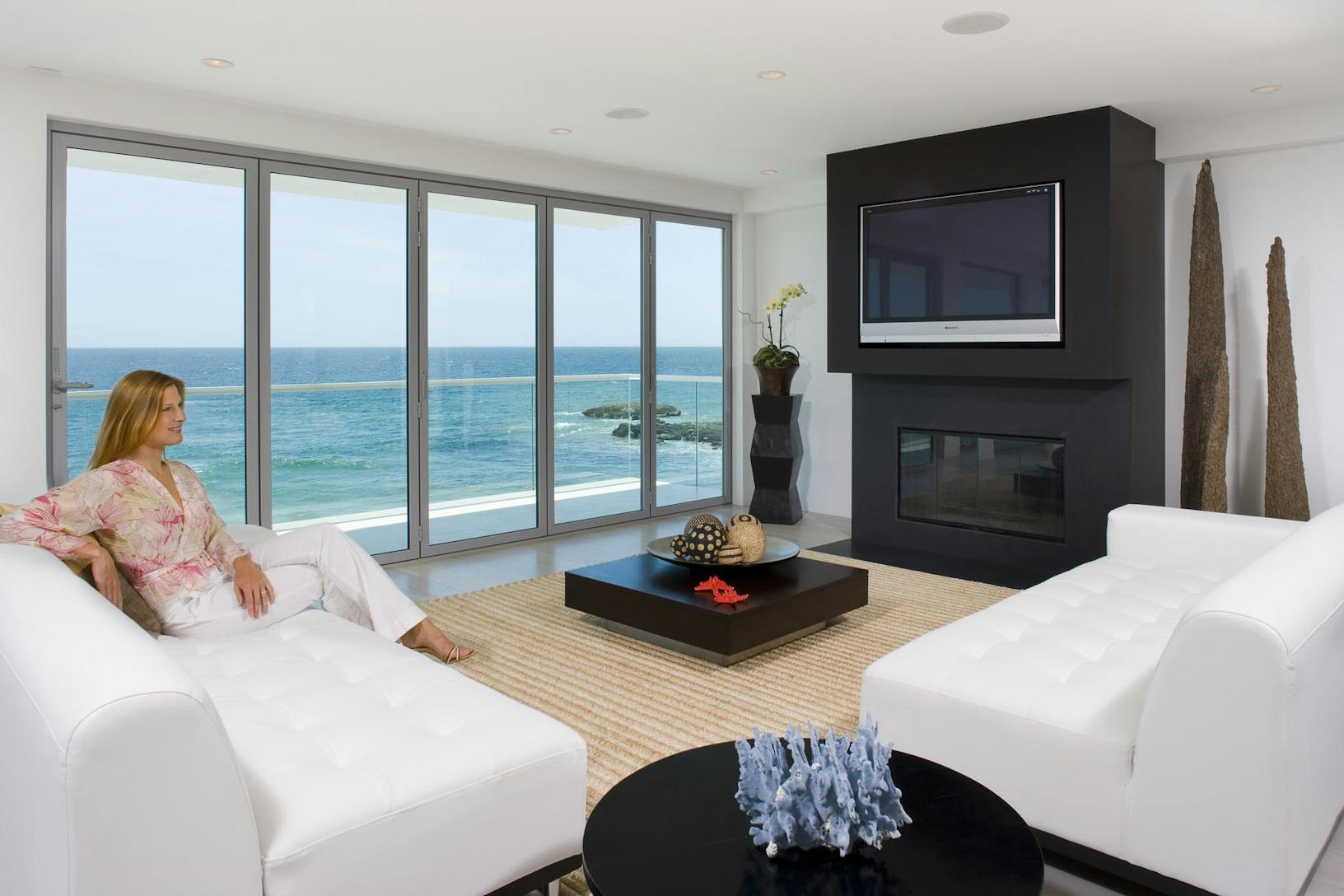 SL45 Oceanfront living room with a large folding balcony doors