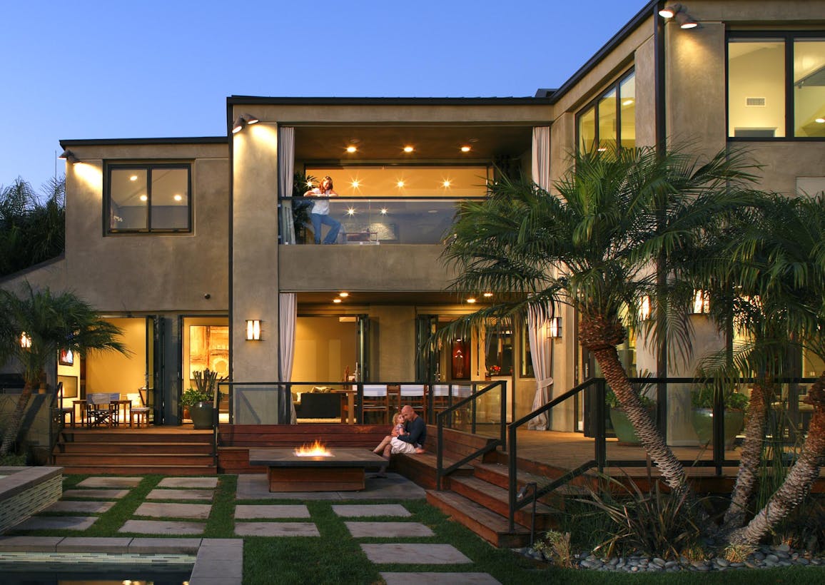 Modern residence with large folding windows leading to a terrace