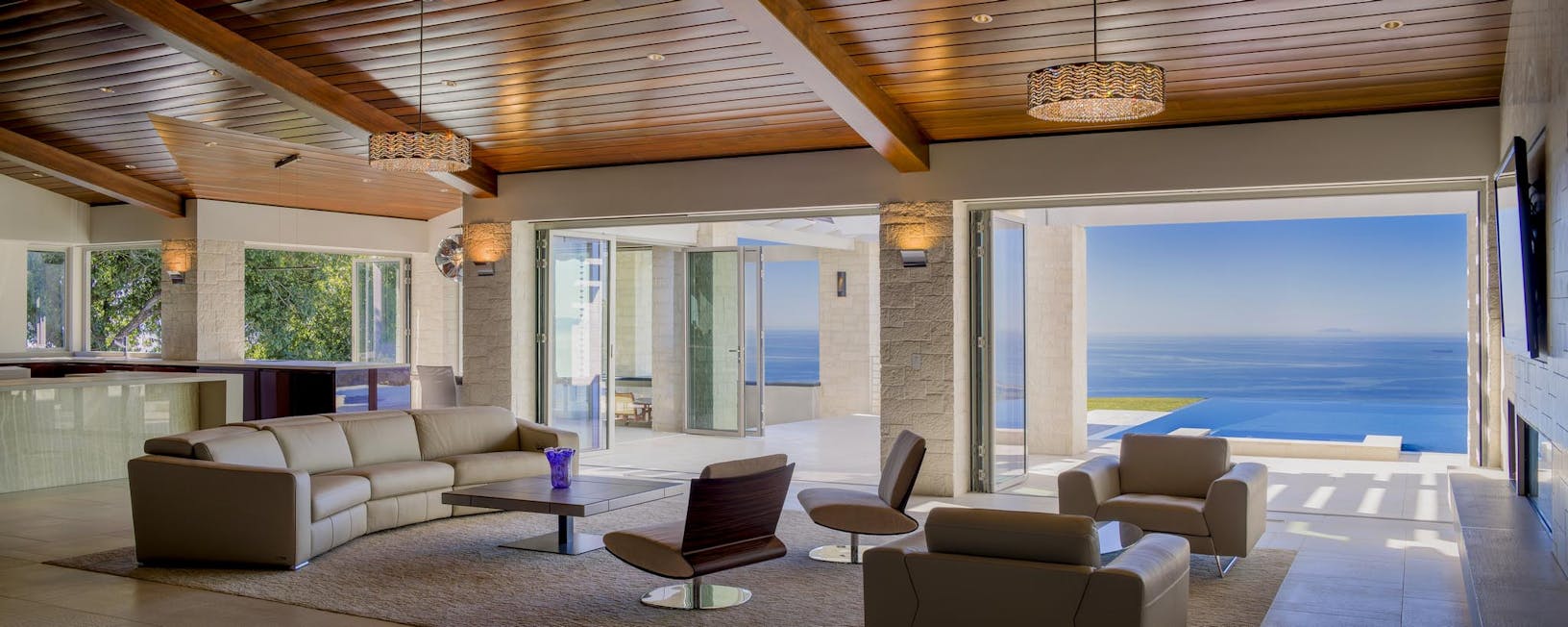 SL45 a modern oceanfront living room with a large glass door