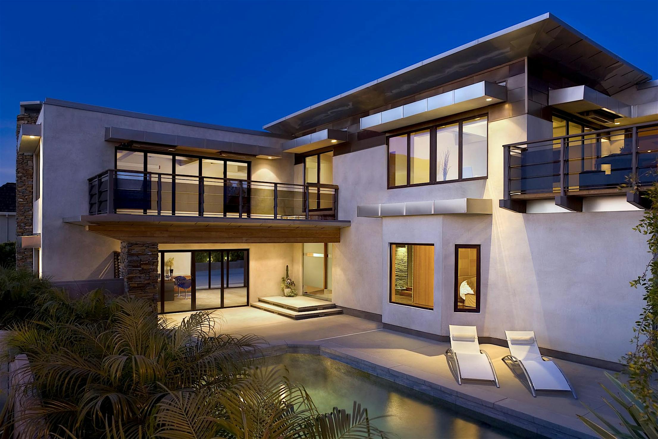 Two story house exterior with glass walls and tilt turn windows - folding