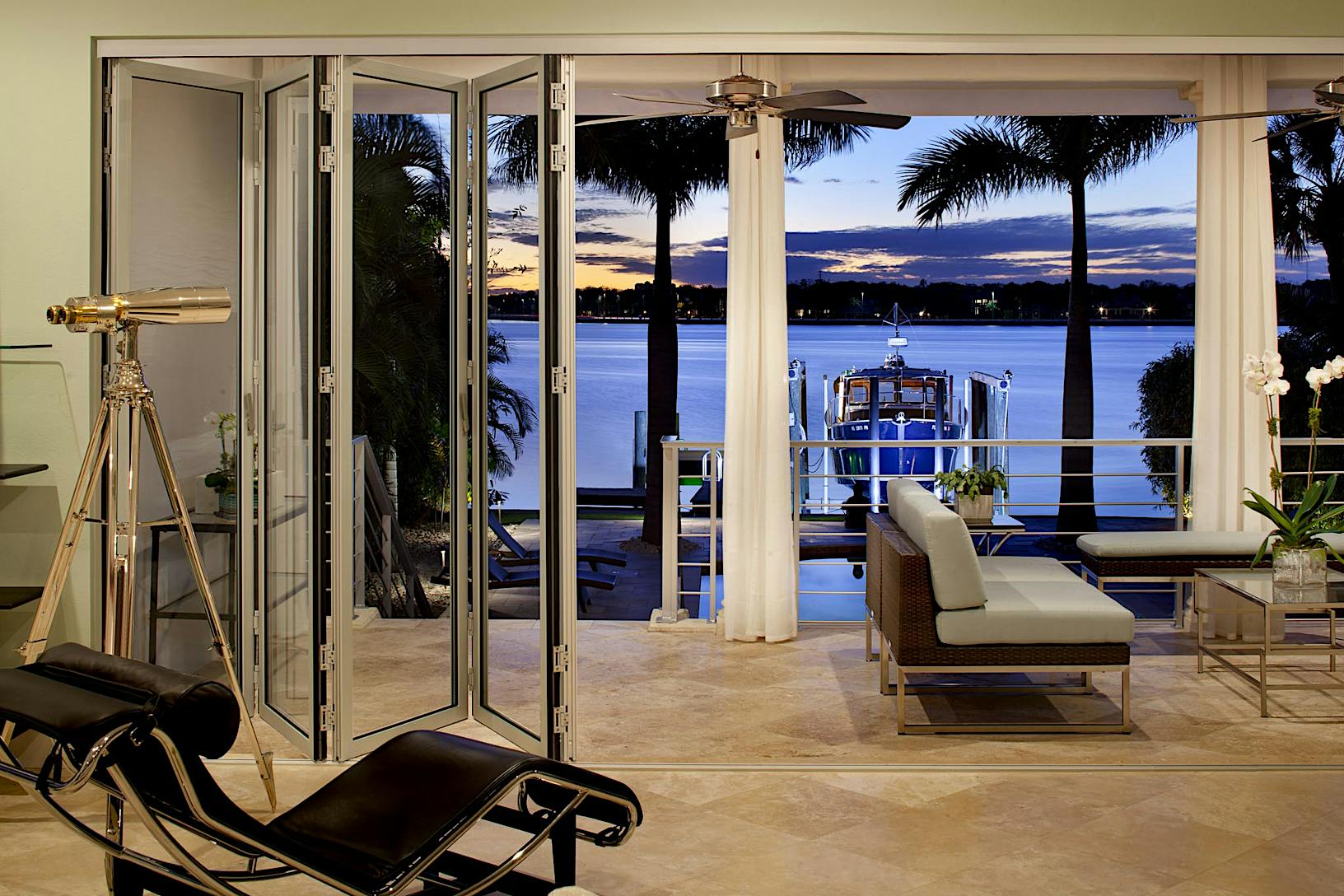 SL45 Living room folding glass walls with a view of the ocean and deck