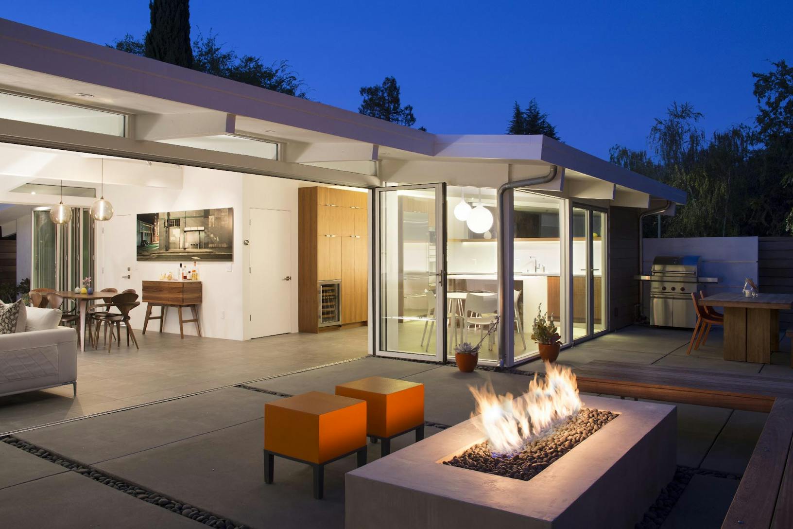 HSW60 a house with sliding patio doors and a fire pit