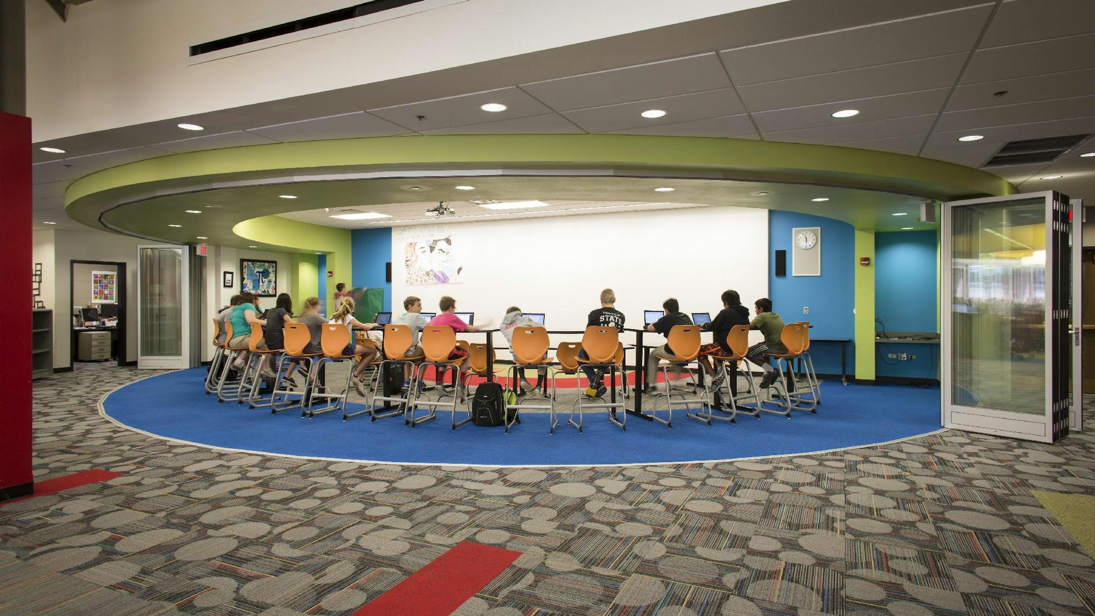 School study space with segmented curved glass walls