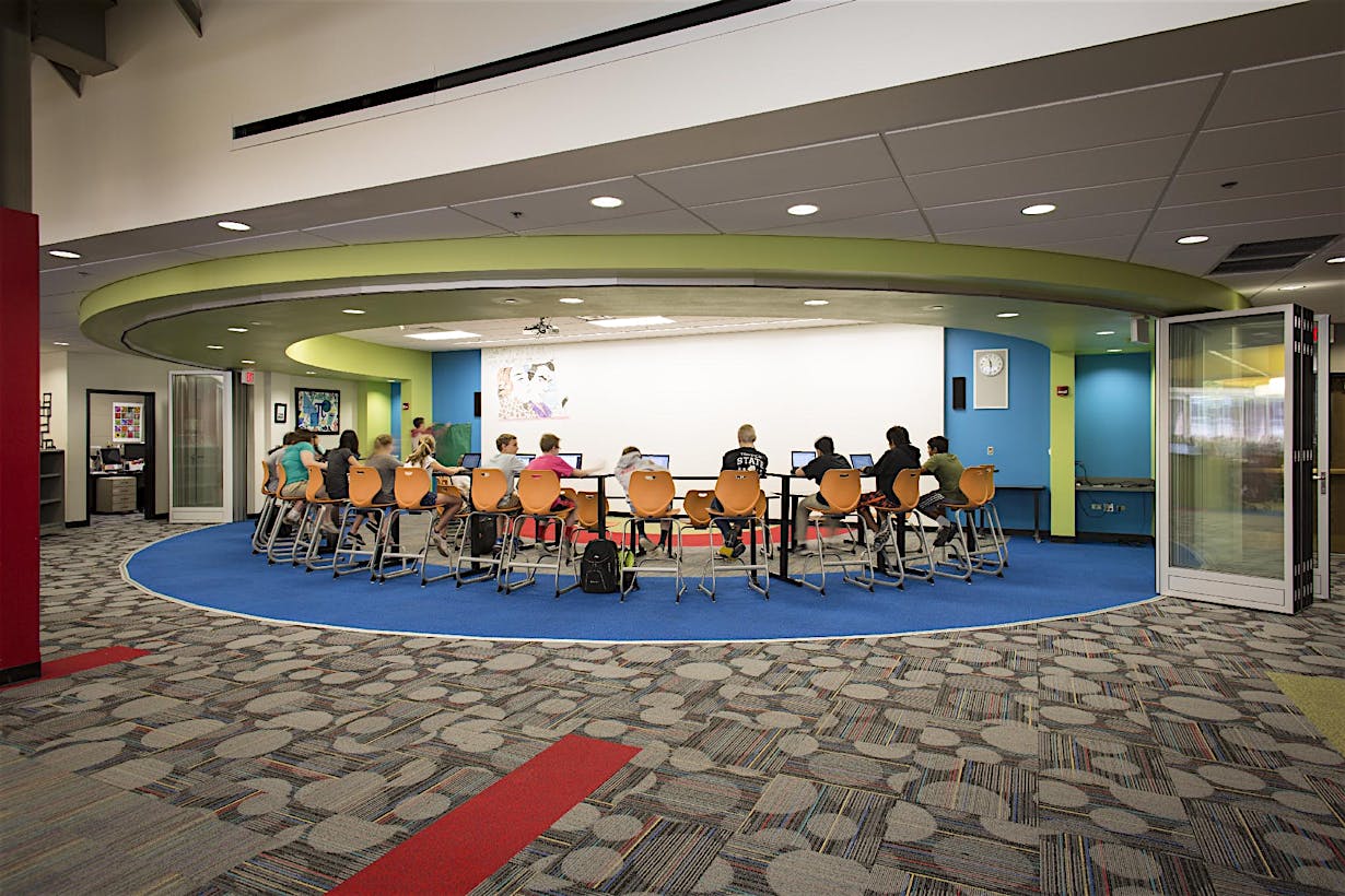 School study space with segmented curved glass walls