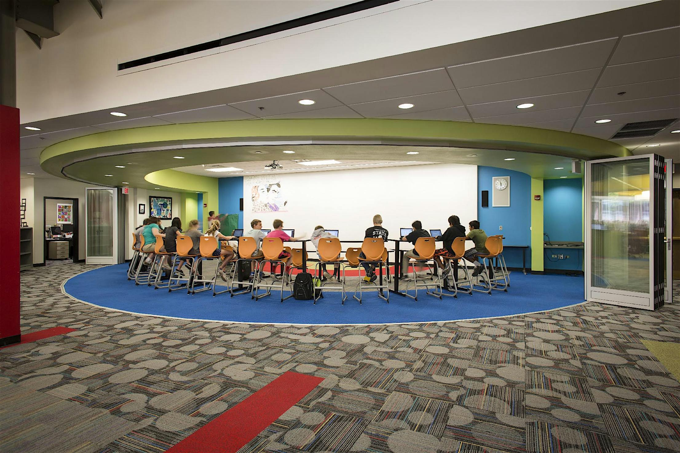 School study space with segmented curved glass walls