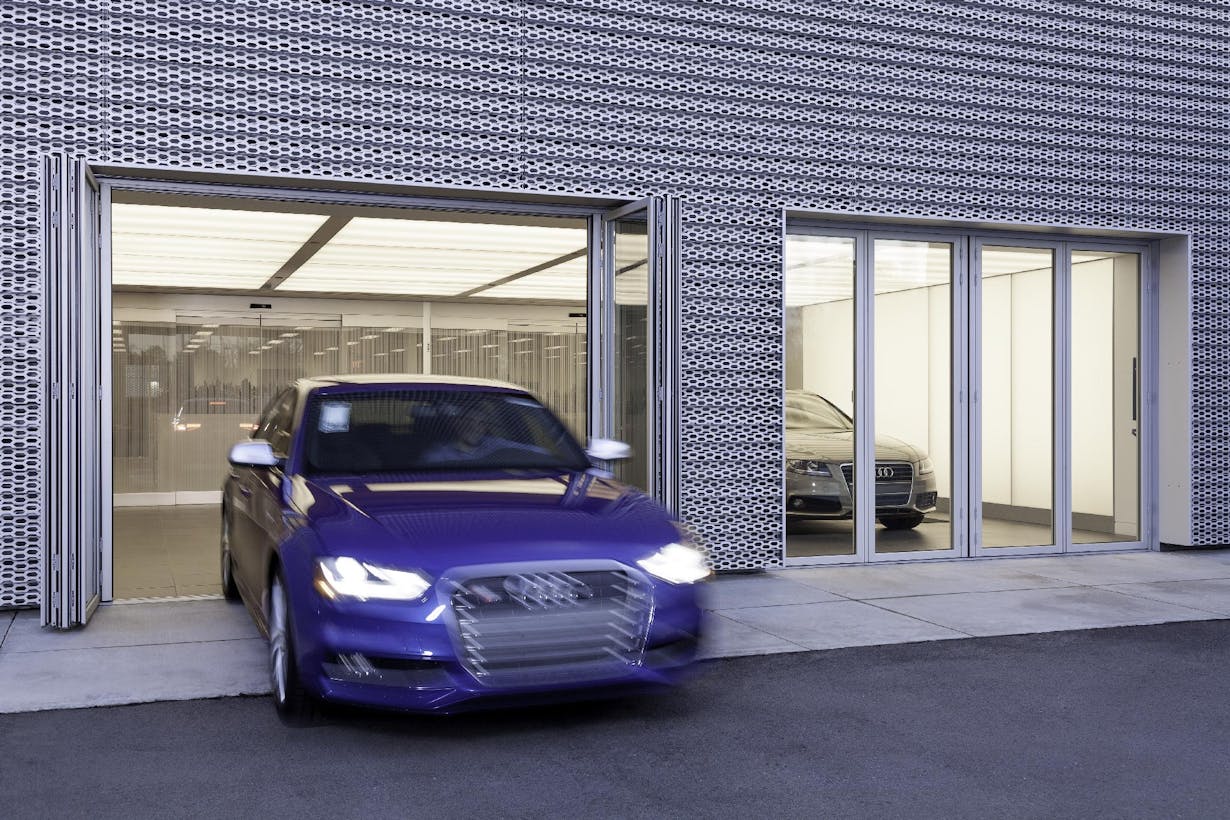 Audi driveway with folding glass walls