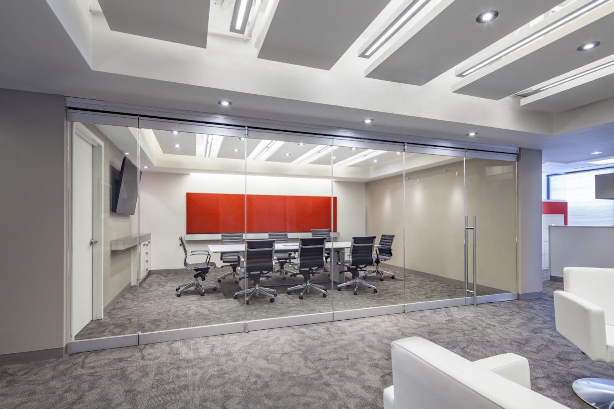 A conference room with all glass partitions