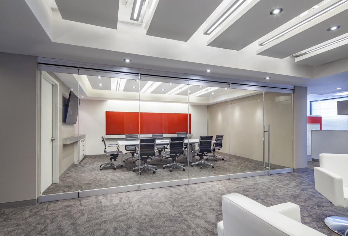 A conference room with all glass partitions