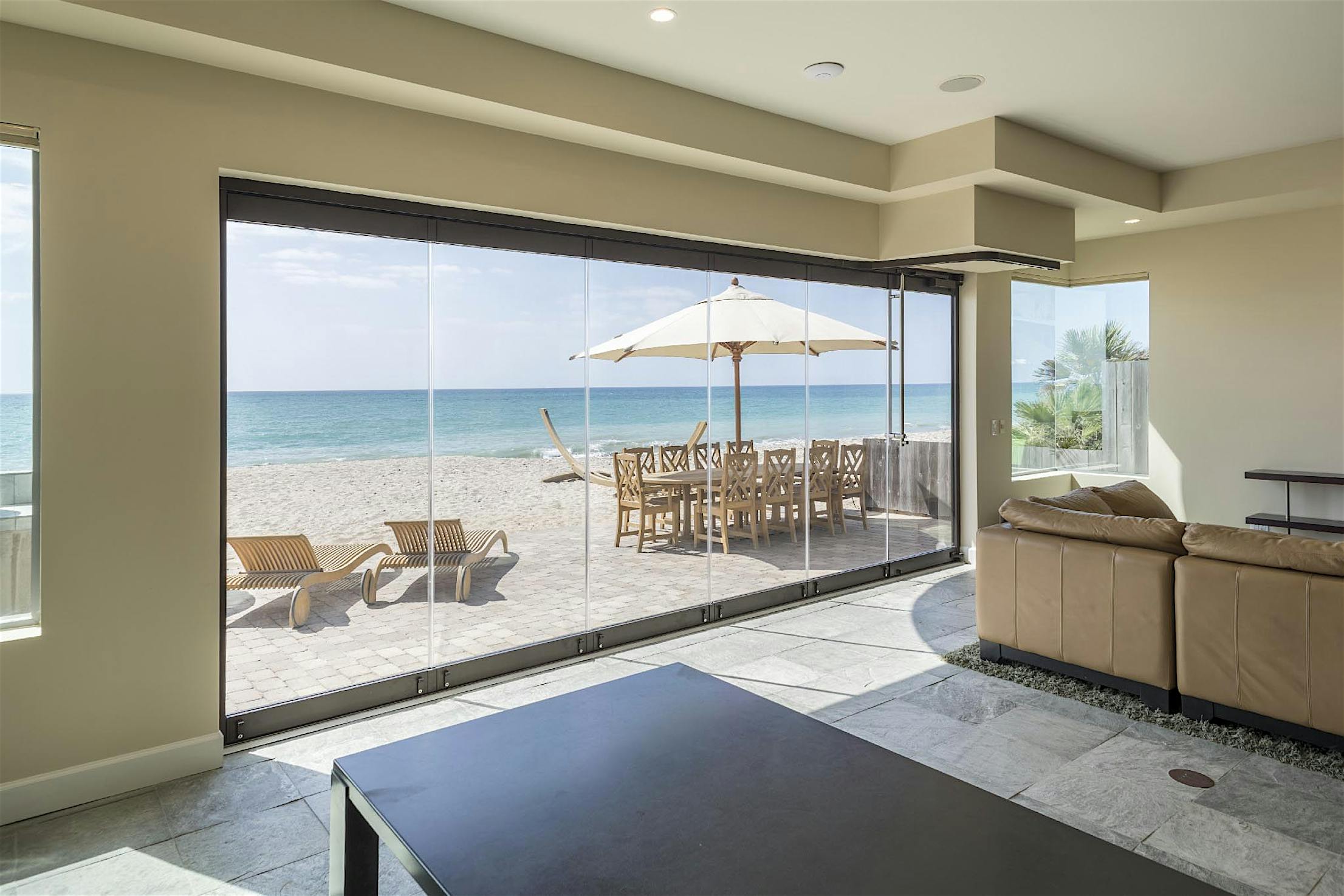 Energy-efficient accordion sliding glass doors in Dana Point, CA offer stunning views and enhance indoor-outdoor living