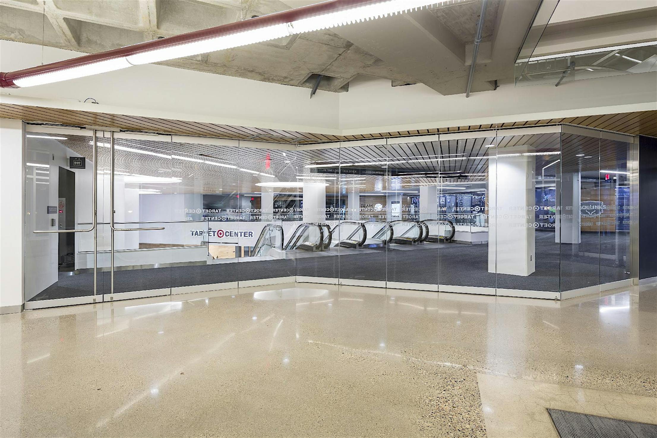 Target center with large frameless folding glass doors