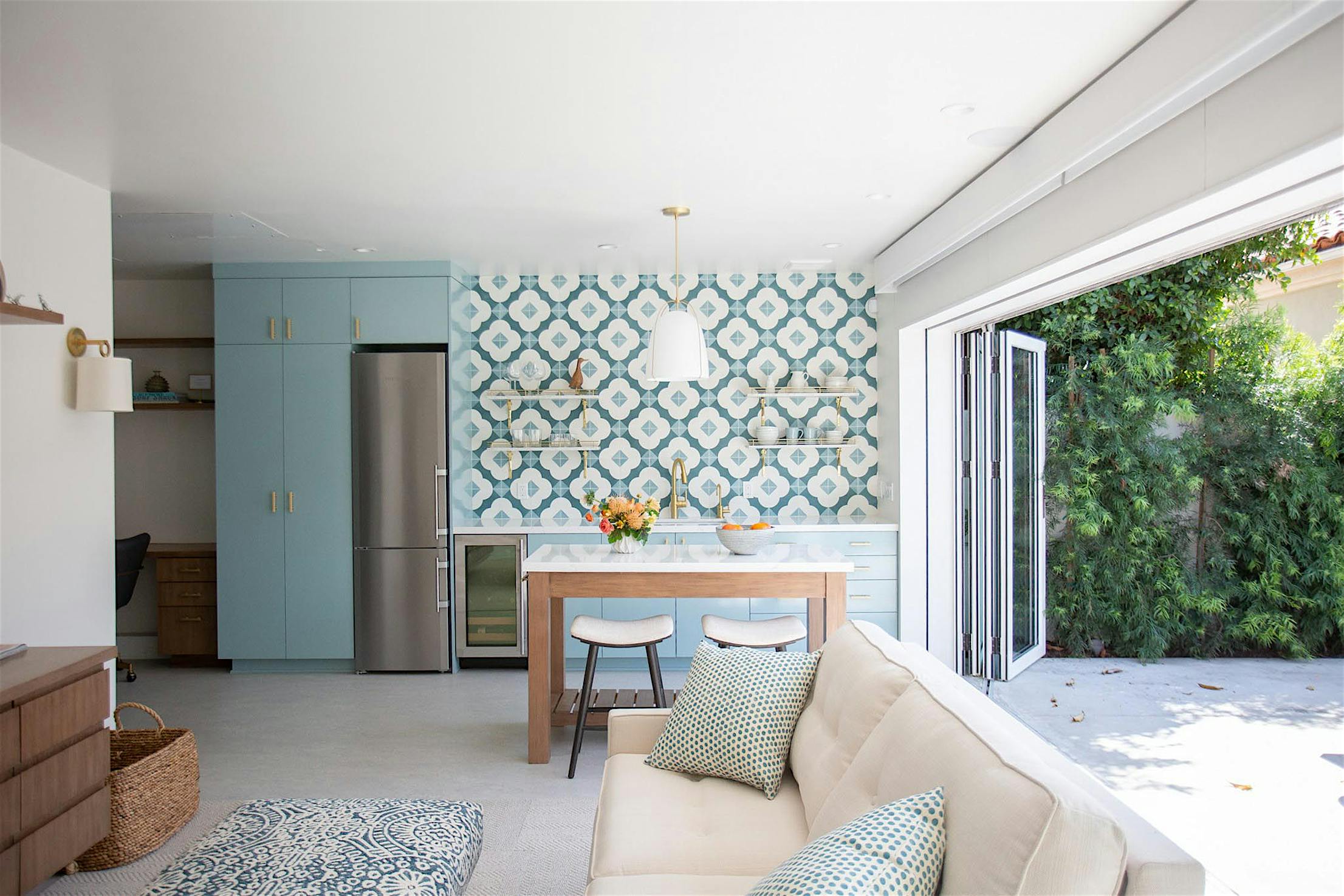 Residential garage conversion -Glass wall folds 180-degree to maximize space