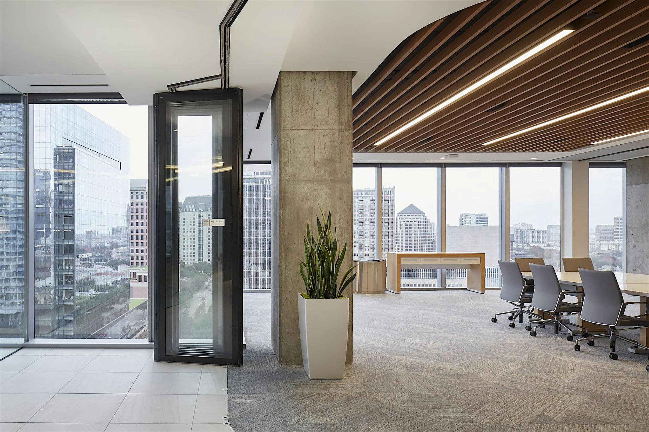 Commercial high rise conference room with stacking glass walls