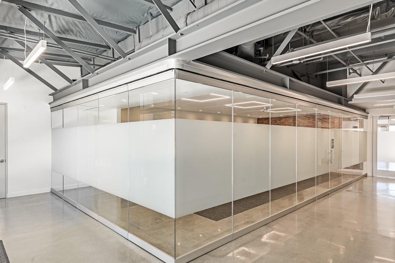 Office Boardroom walled on two sides by Sliding Glass Walls