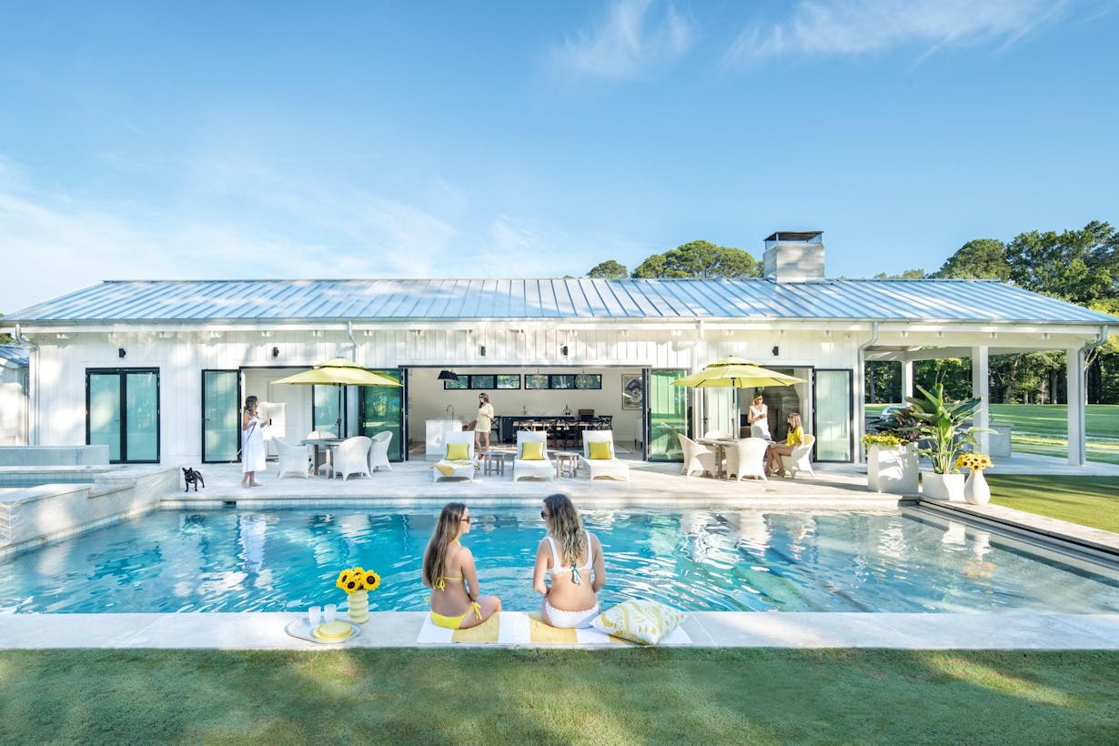 Accordion glass doors with 180-degree stacking in pool house