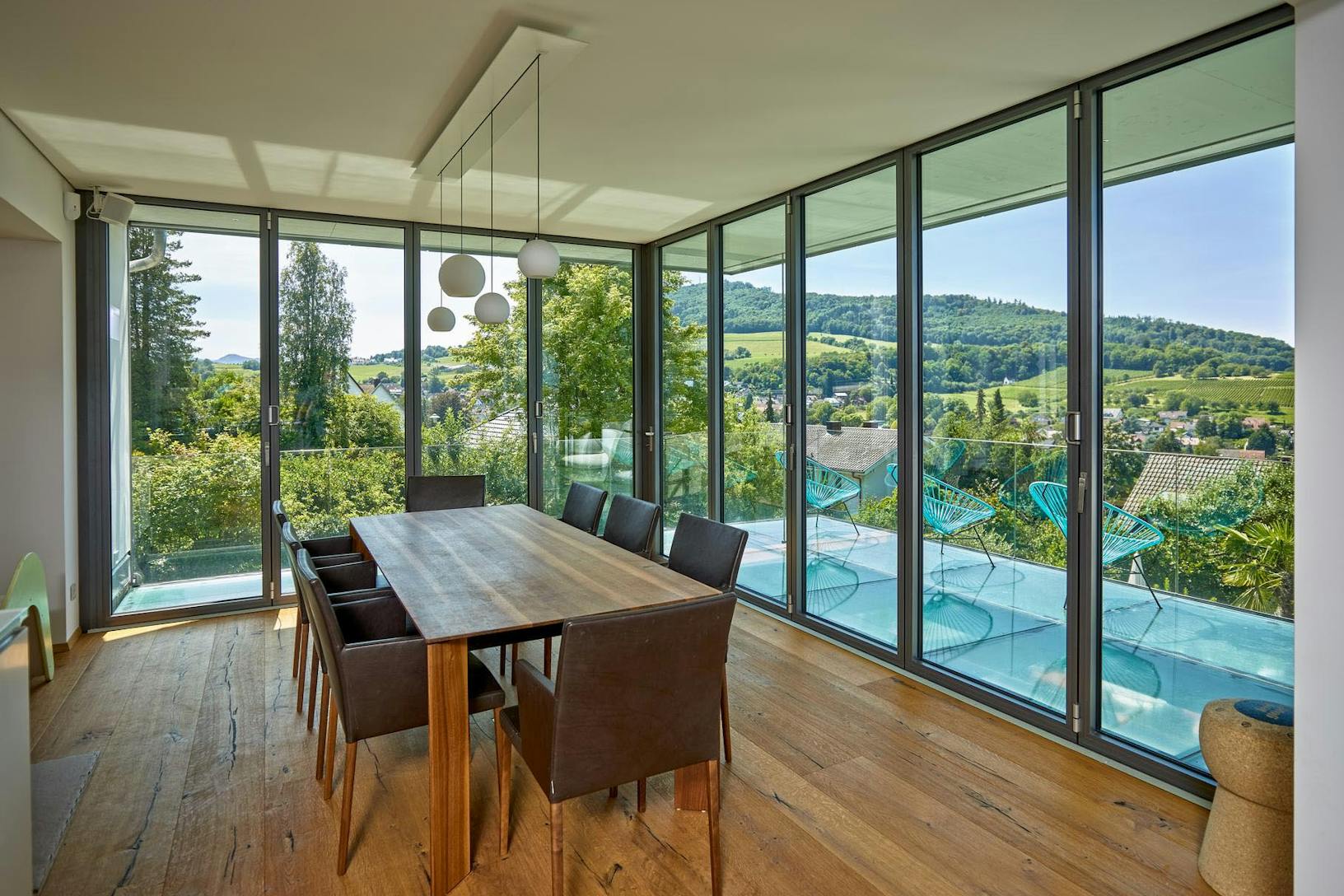 Large dining room with mountain view - closed glass walls 