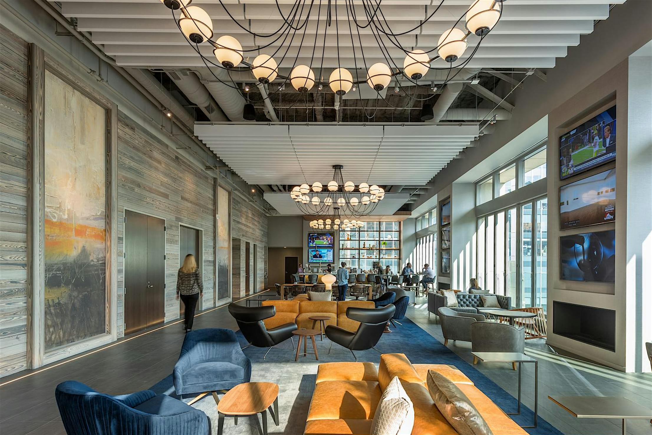 SL70 office space with a large glass wall and a large chandelier - closed interior