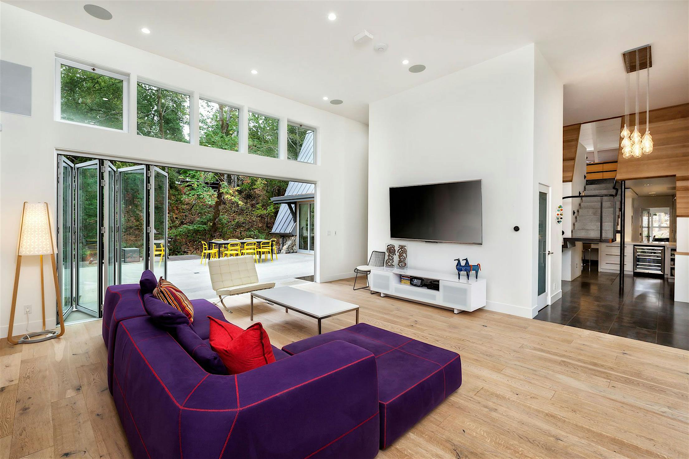Accordion glass patio doors in Willowbrook, CA family home expand living space and enhance indoor-outdoor flow