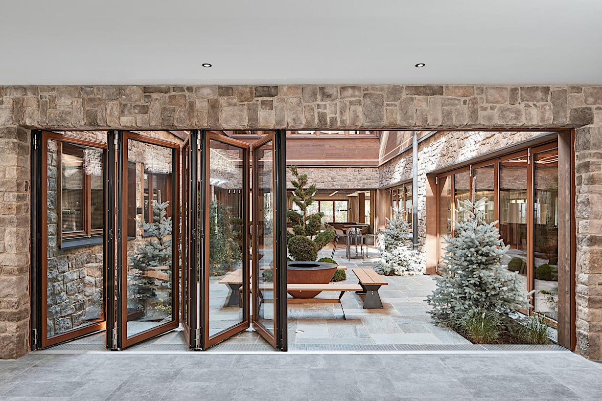 Hotel wood framed folding glass walls - Opening Exterior