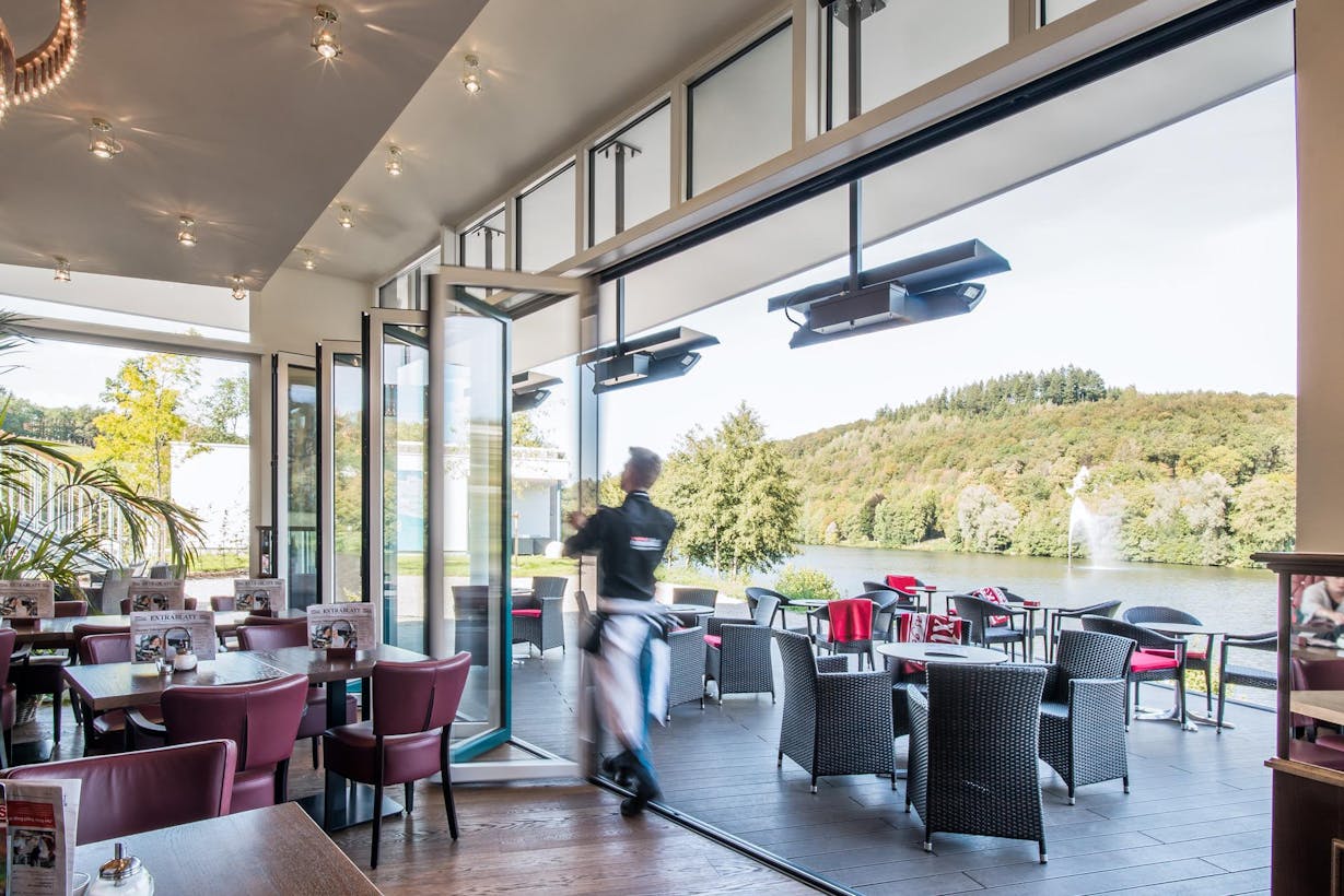 Restaurant commercial design with moveable glass walls to eat outdoors